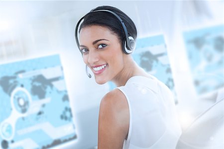 simsearch:400-07138128,k - Pretty call center employee using futuristic interface hologram smiling at the camera Stock Photo - Budget Royalty-Free & Subscription, Code: 400-07057958