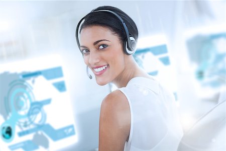 simsearch:400-07138128,k - Pretty call center employee using futuristic holographic interface smiling at the camera in office Stock Photo - Budget Royalty-Free & Subscription, Code: 400-07057959