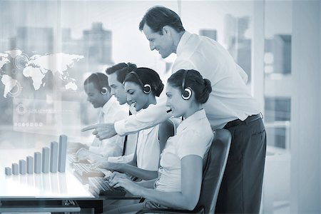 simsearch:400-07138128,k - Call center employees at work on futuristic holograms showing map and graph with supervisor in office Stock Photo - Budget Royalty-Free & Subscription, Code: 400-07057951