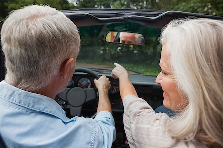 simsearch:400-07057982,k - Rear view of smiling mature couple going for a ride together in classy convertible Foto de stock - Super Valor sin royalties y Suscripción, Código: 400-07057987