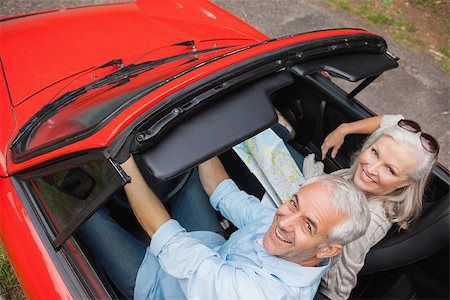 simsearch:400-07057982,k - High angle view of cheerful mature man having a ride with his wife in red convertible Foto de stock - Super Valor sin royalties y Suscripción, Código: 400-07057982