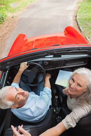 simsearch:400-07057982,k - Mature couple in red classy convertible looking up at camera Foto de stock - Super Valor sin royalties y Suscripción, Código: 400-07057993