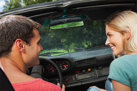 simsearch:400-07058116,k - Rear view of happy couple in cabriolet on a sunny day Stock Photo - Budget Royalty-Free & Subscription, Code: 400-07058117