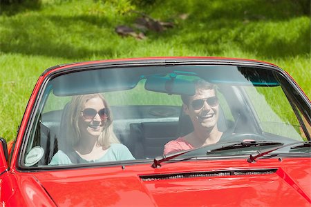 simsearch:400-07058112,k - Happy young couple going for a ride together on a sunny day Photographie de stock - Aubaine LD & Abonnement, Code: 400-07058111