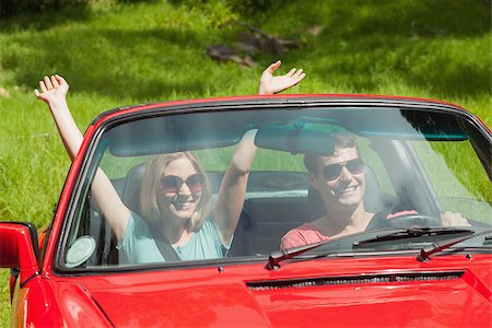 simsearch:400-07058116,k - Smiling young couple going for a ride together on a sunny day Stock Photo - Budget Royalty-Free & Subscription, Code: 400-07058112
