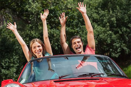 simsearch:400-07058112,k - Happy couple having fun in their cabriolet on a sunny day Photographie de stock - Aubaine LD & Abonnement, Code: 400-07058126