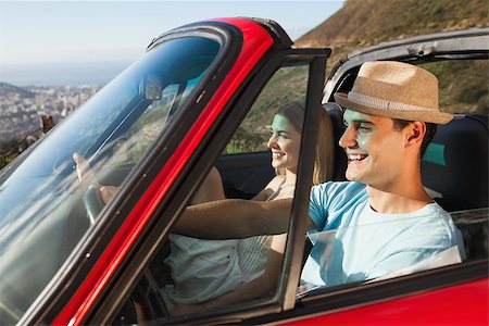 simsearch:400-07058112,k - Smiling couple on their way to the beach in classy cabriolet Photographie de stock - Aubaine LD & Abonnement, Code: 400-07058182