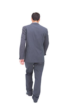 Young businessman walking away from camera on white background Stock Photo - Budget Royalty-Free & Subscription, Code: 400-07058247