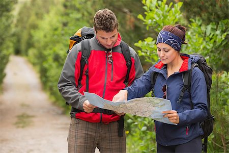 people on trail with map - Happy couple going on a hike together looking at map in the countryside Stock Photo - Budget Royalty-Free & Subscription, Code: 400-07058564