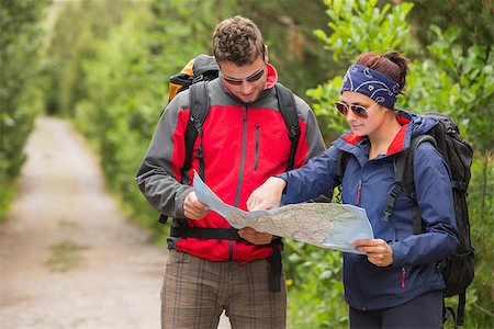 people on trail with map - Couple going on a hike together looking at map in the countryside Stock Photo - Budget Royalty-Free & Subscription, Code: 400-07058562