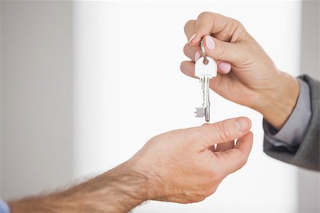 simsearch:400-07475963,k - Estate agent giving key to customer in an empty house Stock Photo - Budget Royalty-Free & Subscription, Code: 400-07058967
