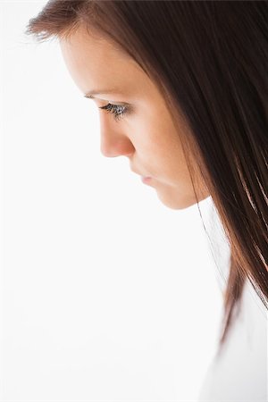 simsearch:400-06932687,k - Thoughtful girl looking away on white background Stock Photo - Budget Royalty-Free & Subscription, Code: 400-07059132