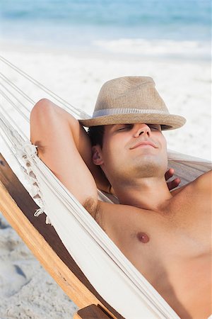 pictures of men sleeping in hammocks - Man wearing straw hat lying in hammock and sleeping on holidays Stock Photo - Budget Royalty-Free & Subscription, Code: 400-07059238