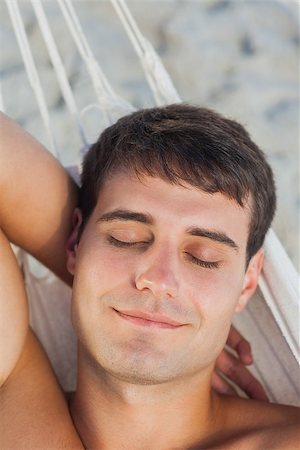 pictures of men sleeping in hammocks - Peaceful man sleeping in hammock on holidays Stock Photo - Budget Royalty-Free & Subscription, Code: 400-07059239