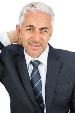 Businessman looking at camera touching his painful neck on white background Stock Photo - Budget Royalty-Free & Subscription, Code: 400-07059357