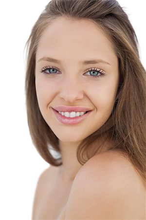Smiling brunette model looking at camera on white background Stock Photo - Budget Royalty-Free & Subscription, Code: 400-07059560