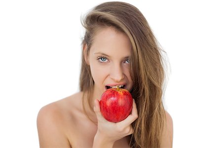 Pretty brunette model eating an apple on white background Stock Photo - Budget Royalty-Free & Subscription, Code: 400-07059693
