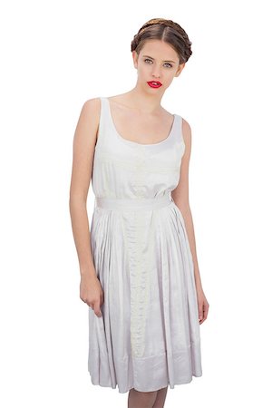 simsearch:400-04204887,k - Serious model in white dress posing looking at camera on white background Foto de stock - Super Valor sin royalties y Suscripción, Código: 400-07059861