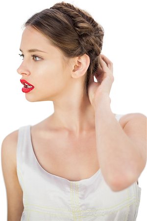 simsearch:400-07059876,k - Puzzled model in white dress touching her hair and looking away on white background Foto de stock - Super Valor sin royalties y Suscripción, Código: 400-07059878