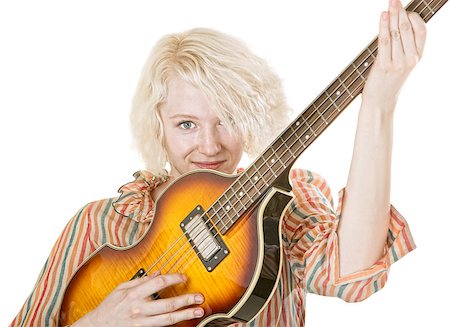 Grinning young lady electric guitarist on isolated background Stock Photo - Budget Royalty-Free & Subscription, Code: 400-07050189
