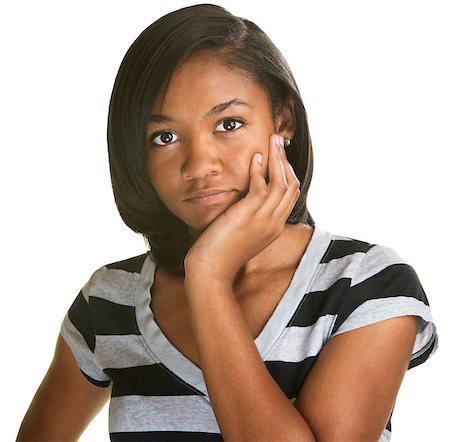 Pensive female teenager with chin in palm on isolated background Stock Photo - Budget Royalty-Free & Subscription, Code: 400-07050217