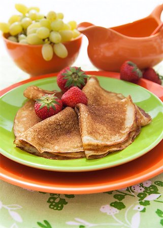 simsearch:400-04677383,k - Fresh pancakes (blini) with strawberries on colorful dish Stock Photo - Budget Royalty-Free & Subscription, Code: 400-07050769