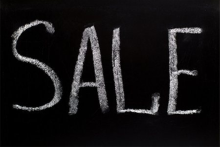 reduced sign in a shop - Word sale writtent with white chalk on blackboard Stock Photo - Budget Royalty-Free & Subscription, Code: 400-07052243