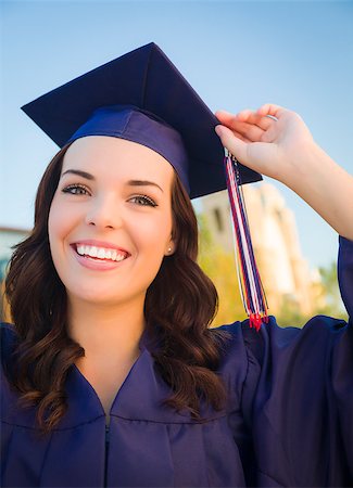 Happy Graduating Mixed Race Woman In Cap and Gown Celebrating on Campus. Stock Photo - Budget Royalty-Free & Subscription, Code: 400-07052308