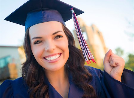 Happy Graduating Mixed Race Woman In Cap and Gown Celebrating on Campus. Stock Photo - Budget Royalty-Free & Subscription, Code: 400-07052309