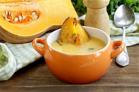 pumpkin cream soup with pieces roasted pumpkin and thyme Stock Photo - Budget Royalty-Free & Subscription, Code: 400-07053504