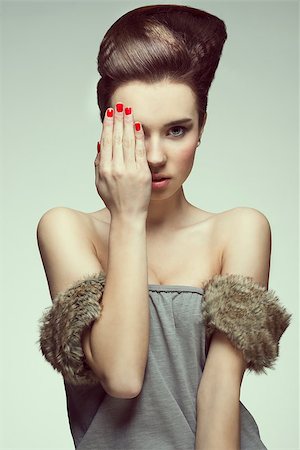 simsearch:400-07425613,k - pretty and sexy young girl with creative hairstyle looking in camera and covering one eyes with hand Stock Photo - Budget Royalty-Free & Subscription, Code: 400-07053525