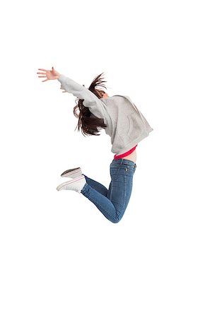 simsearch:400-06690896,k - Cheerful young woman jumping on white background Stock Photo - Budget Royalty-Free & Subscription, Code: 400-07060042