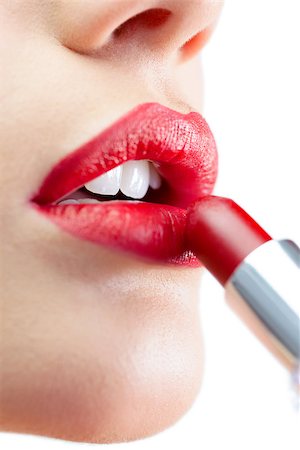 simsearch:400-07059876,k - Extreme close up on gorgeous model on white background applying red lipstick Foto de stock - Super Valor sin royalties y Suscripción, Código: 400-07060218