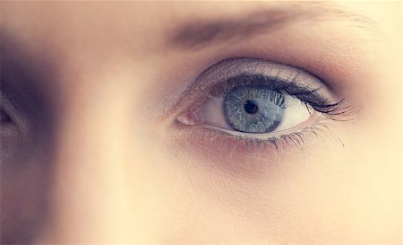 stylish eye makeup - Extreme close up on beautiful shinning blue eye looking at camera Stock Photo - Budget Royalty-Free & Subscription, Code: 400-07060444