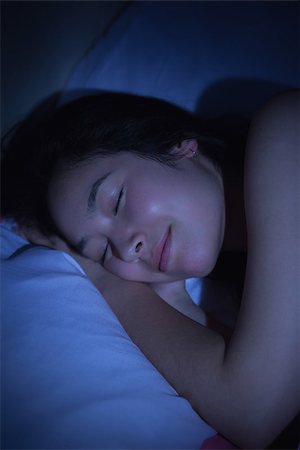 Young asian woman sleeping happily at night at home in bedroom Stock Photo - Budget Royalty-Free & Subscription, Code: 400-07060661