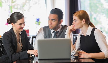 simsearch:400-07137867,k - Cheerful business people working with their laptop in restaurant Fotografie stock - Microstock e Abbonamento, Codice: 400-07060765