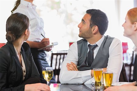 simsearch:400-07137867,k - Business people talking to the waiter in the restaurant Fotografie stock - Microstock e Abbonamento, Codice: 400-07060773