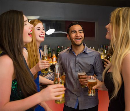 pic of friends in bar celebration - Laughing friends chatting and drinking beer in the nightclub Stock Photo - Budget Royalty-Free & Subscription, Code: 400-07060851