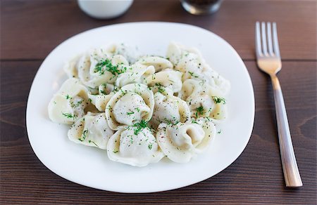 raw chicken dishes - Fresh boiled meat dumplings served with dill on a plate Stock Photo - Budget Royalty-Free & Subscription, Code: 400-07061579