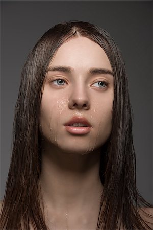 simsearch:400-04001073,k - beauty close-up portrait of pretty brunette woman with long wet smooth hair and some water drops on the visage Photographie de stock - Aubaine LD & Abonnement, Code: 400-07061676