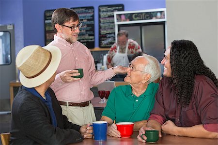 simsearch:400-07042108,k - Group of adults in restaurant talking to each other Stock Photo - Budget Royalty-Free & Subscription, Code: 400-07061784