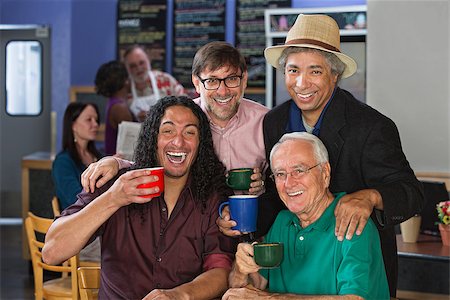 simsearch:400-07042113,k - Diverse group of men celebrating in coffee house Stock Photo - Budget Royalty-Free & Subscription, Code: 400-07061783