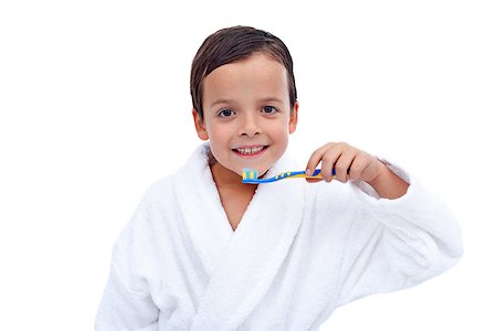 Little boy in bathrobe washing his teeth after evening bath - isolated Stock Photo - Budget Royalty-Free & Subscription, Code: 400-07086839