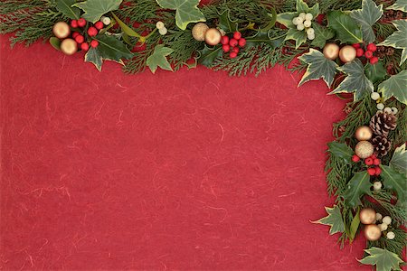 simsearch:400-06356099,k - Christmas floral border with gold bauble decorations, holly, mistletoe, ivy, fir leaf sprigs over red mottled  background. Stock Photo - Budget Royalty-Free & Subscription, Code: 400-07086876