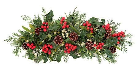 simsearch:400-06356099,k - Christmas floral decoration with holly, ivy, mistletoe, pinecones and winter greenery over white background. Stock Photo - Budget Royalty-Free & Subscription, Code: 400-07086872