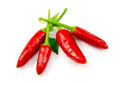 pitamaha (artist) - Four red chillies on white background Fotografie stock - Microstock e Abbonamento, Codice: 400-07087295