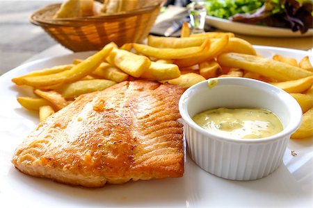 poached salmon - grilled salmon and fries - french cuisine dish with tomato and salmon Stock Photo - Budget Royalty-Free & Subscription, Code: 400-07087528