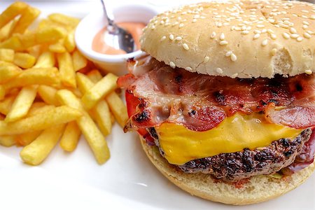 simsearch:400-05330097,k - Cheese burger - American cheese burger with fresh salad Stock Photo - Budget Royalty-Free & Subscription, Code: 400-07087520