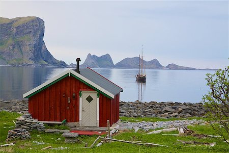 Old fishing hut in scenic fjord with sailing ship in Norway Stock Photo - Budget Royalty-Free & Subscription, Code: 400-07087791