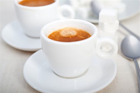 simsearch:400-04554624,k - Italian espresso coffee fresh brewed macro closeup with sugar cubes Stock Photo - Budget Royalty-Free & Subscription, Code: 400-07088157